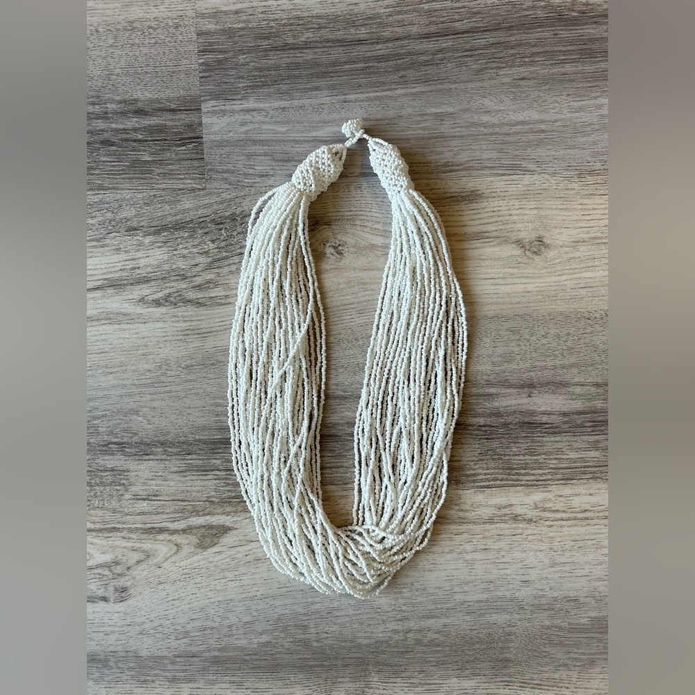 White multi strand beaded necklace